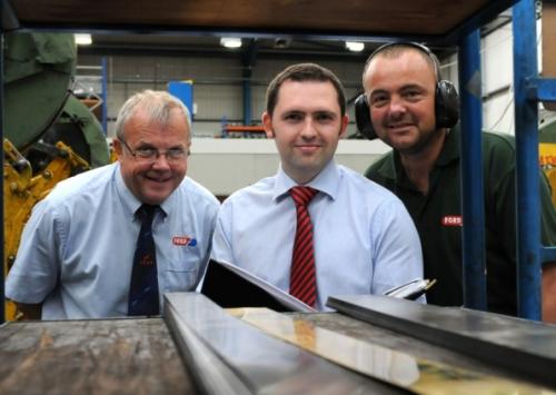 Giles Johnston (centre) with employees from Ford Components at the end of a successful project.