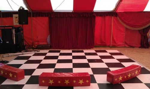 dance floor, dj and stage area for circus party