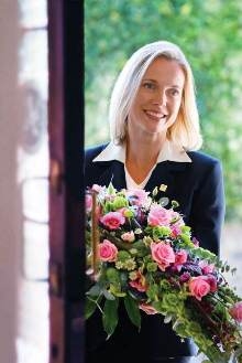 Lady Funeral Director With Flowers