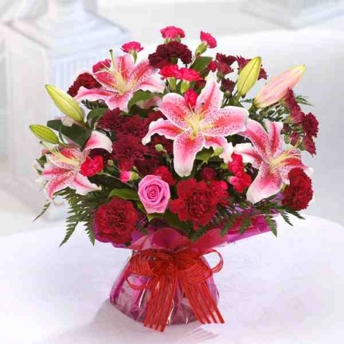 Mixed hand tied to include Lily's, Roses and Carnations. From £40.