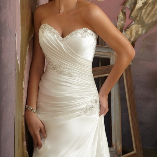 Stunning detailing on a soft satin bridal gown