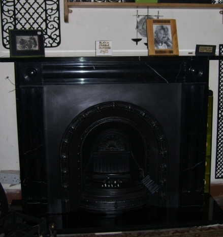 Cast Iron Arch with a Black Marble surround
