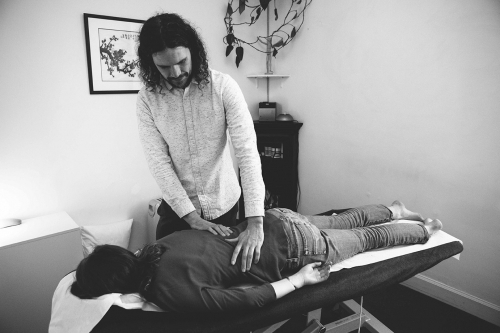 Adam Harker of Tide Osteopathy, treating a patient at his osteopathic studio in Broughton, Edinburgh.